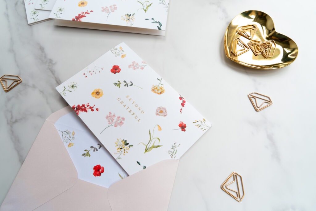 An elegant gold heart-shaped box featuring a decorative gold heart, representing affection and luxury.